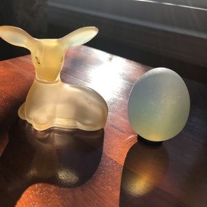 Empty Avon deer bottle and a unique egg paperweight